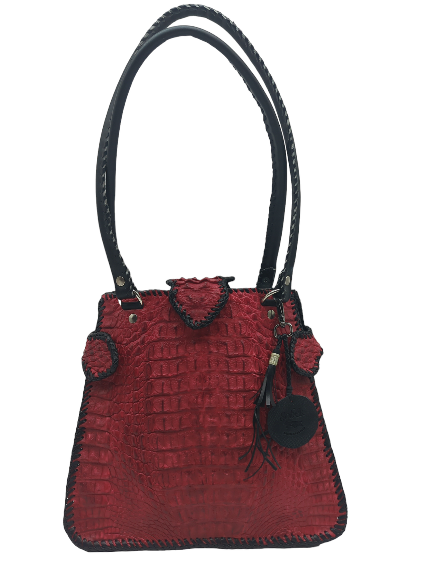 A carmine red alligator leather shoulder bag with a black strap and zippered closure, featuring a whip stitching design.