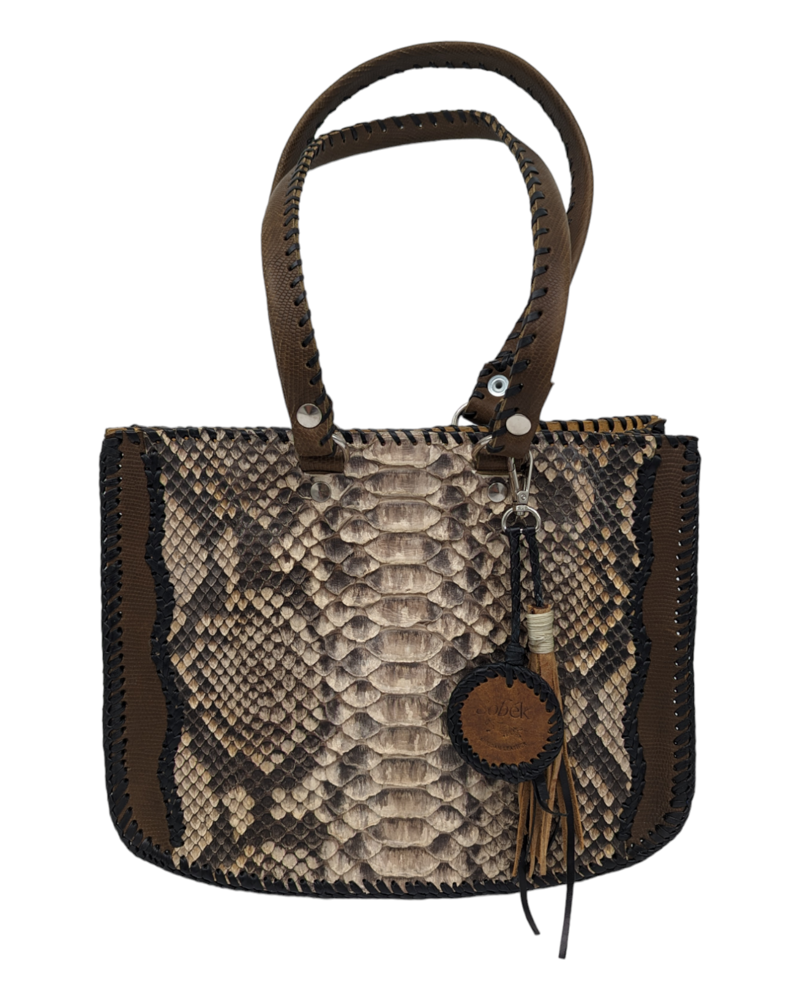 A handcrafted tote bag with python skin and calfskin leather in a taupe tone, featuring a whip stitching design, a top handle, and a tassel detail.