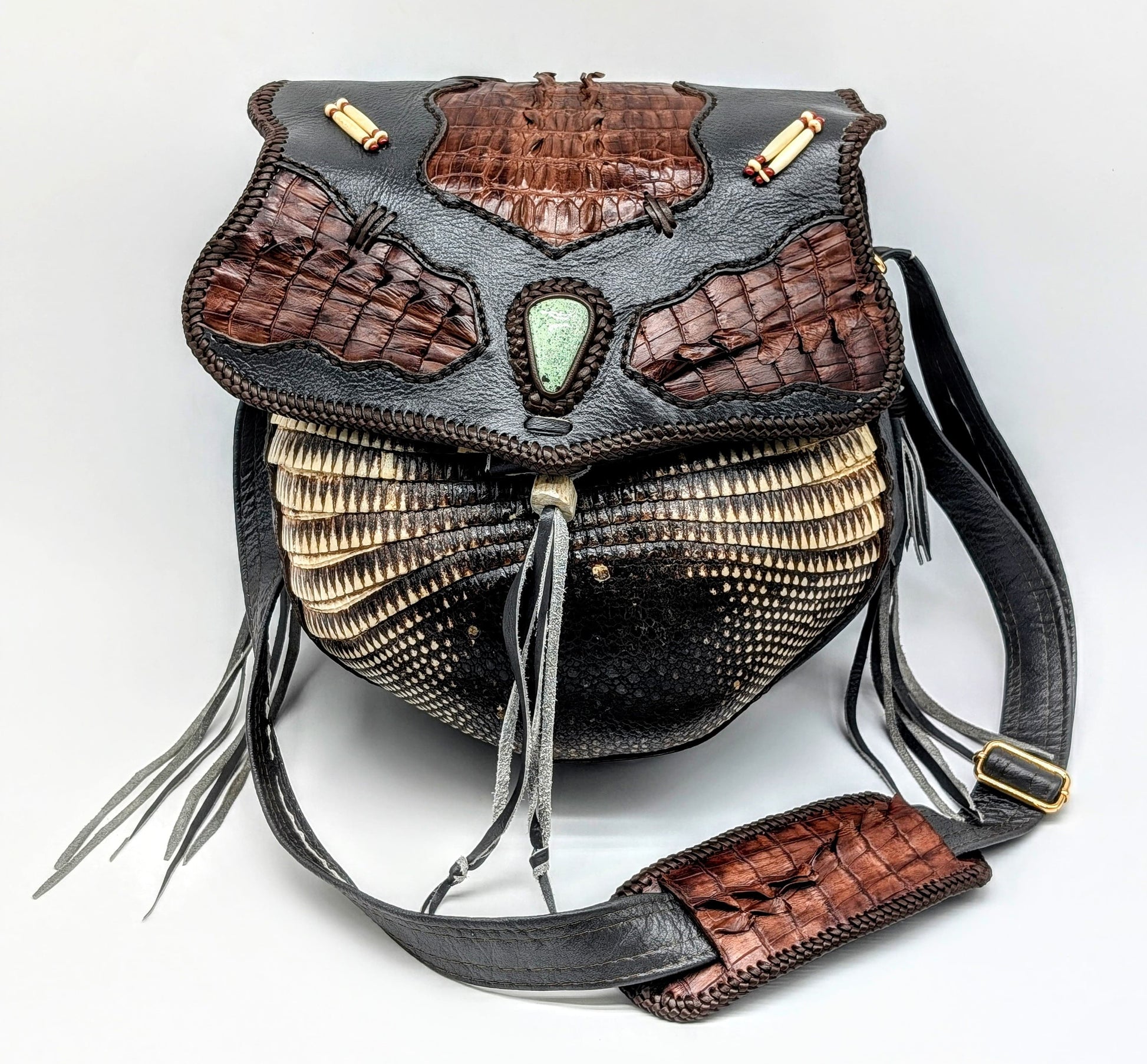 Decorative handbag with intricate design on a white background