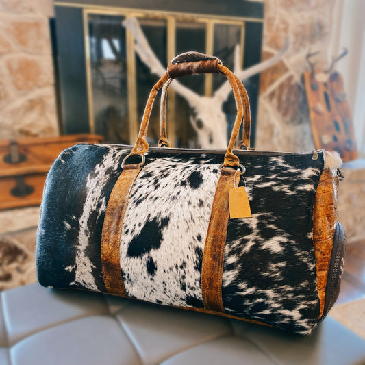 Black and White Spotted Cowhide Genuine Distressed Leather Barrel Duffel Bag